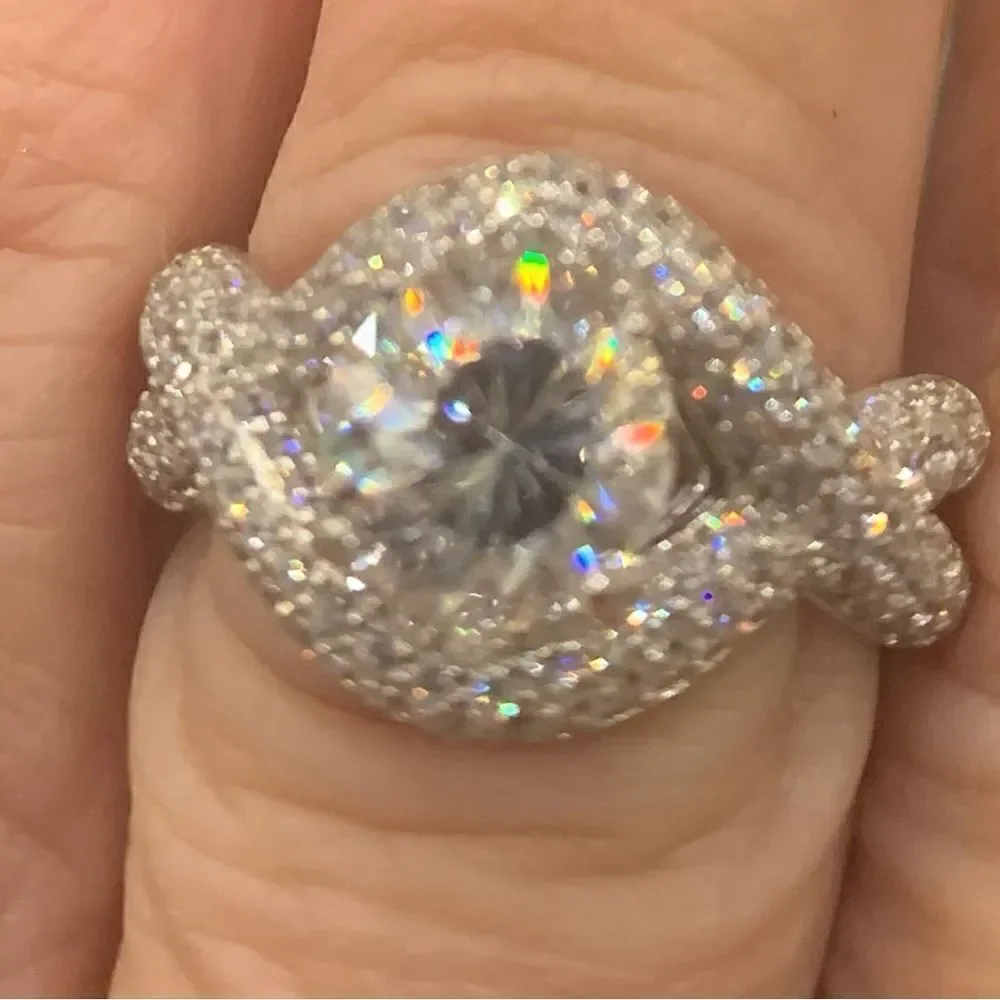 Unique and lovely solitaire style with a wrap effect size 8. CZ and silver